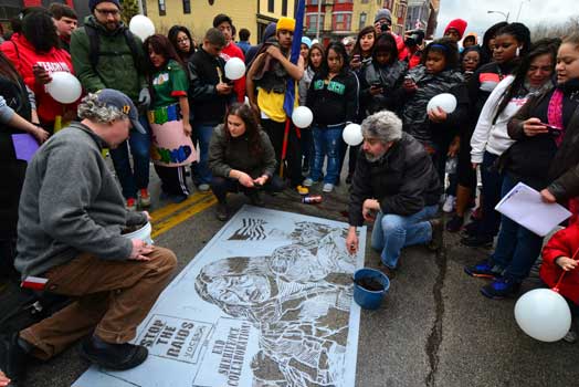 mud stencils and banners at the Milwaukee May Day – Immigrant Rights March