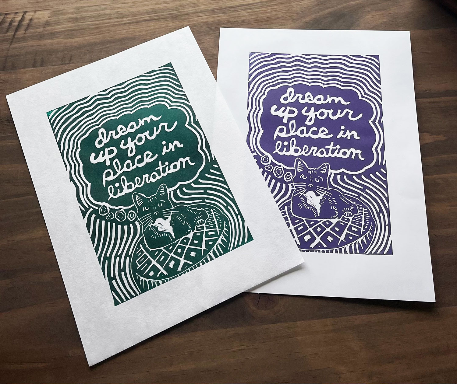 two relief prints in two different colors, green on the left and purple on the right.