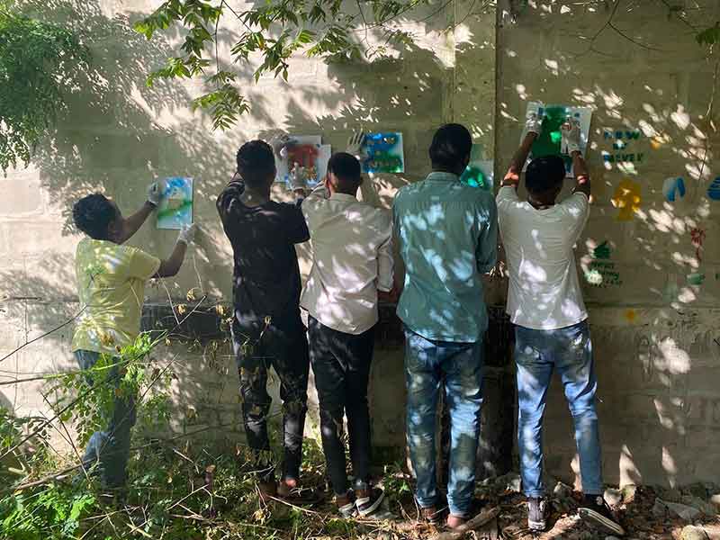 a group spraying a stencil